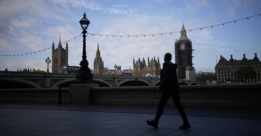 The scaffolded Elizabeth Tower, known as Big Ben, and the Houses of Parliament are seen from the other side of the River Thames, in London, U.K., Oct. 14, 2021. (AP Photo)