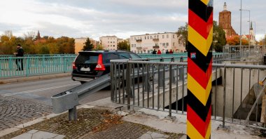 People cross the border between Germany and Poland in Guben, Germany, October 23, 2021.     (Reuters Photo)