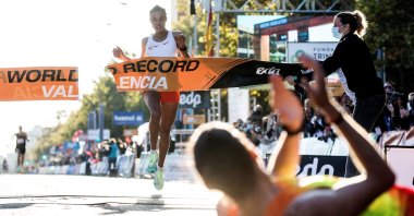 Ethiopia's Letesenbet Gidey crosses the finish line and breaks the world record at the Valencia Half Marathon in the coastal city of Valencia, eastern Spain, Oct. 24, 2021. (EPA Photo)