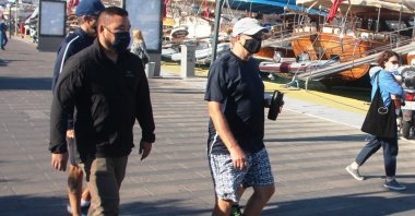 Bill Gates (C) walks toward a boat waiting for him at the port in Bodrum, Muğla, southwestern Turkey, Oct. 24, 2021. (IHA Photo)