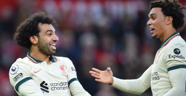 Liverpool's Mohamed Salah (L) celebrates with Trent Alexander-Arnold (R) after scoring the 0-3 goal during the English Premier League soccer match between Manchester United and Liverpool FC in Manchester, Britain, Oct. 24, 2021. (EPA Photo)