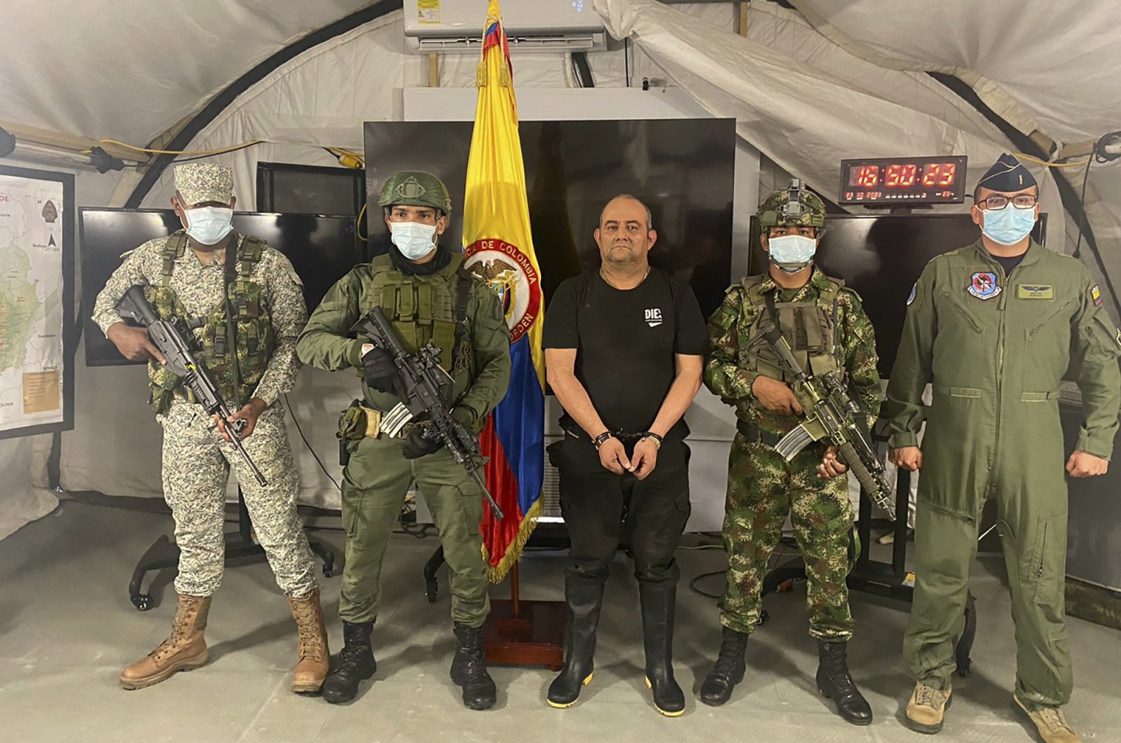 In this photo released by the Colombian presidential press office, one of the country’s most wanted drug traffickers, Dairo Antonio Usuga, alias “Otoniel,” leader of the violent Clan del Golfo cartel, is presented to the media at a military base in Necocli, Colombia, Oct. 23, 2021. (AP Photo)
