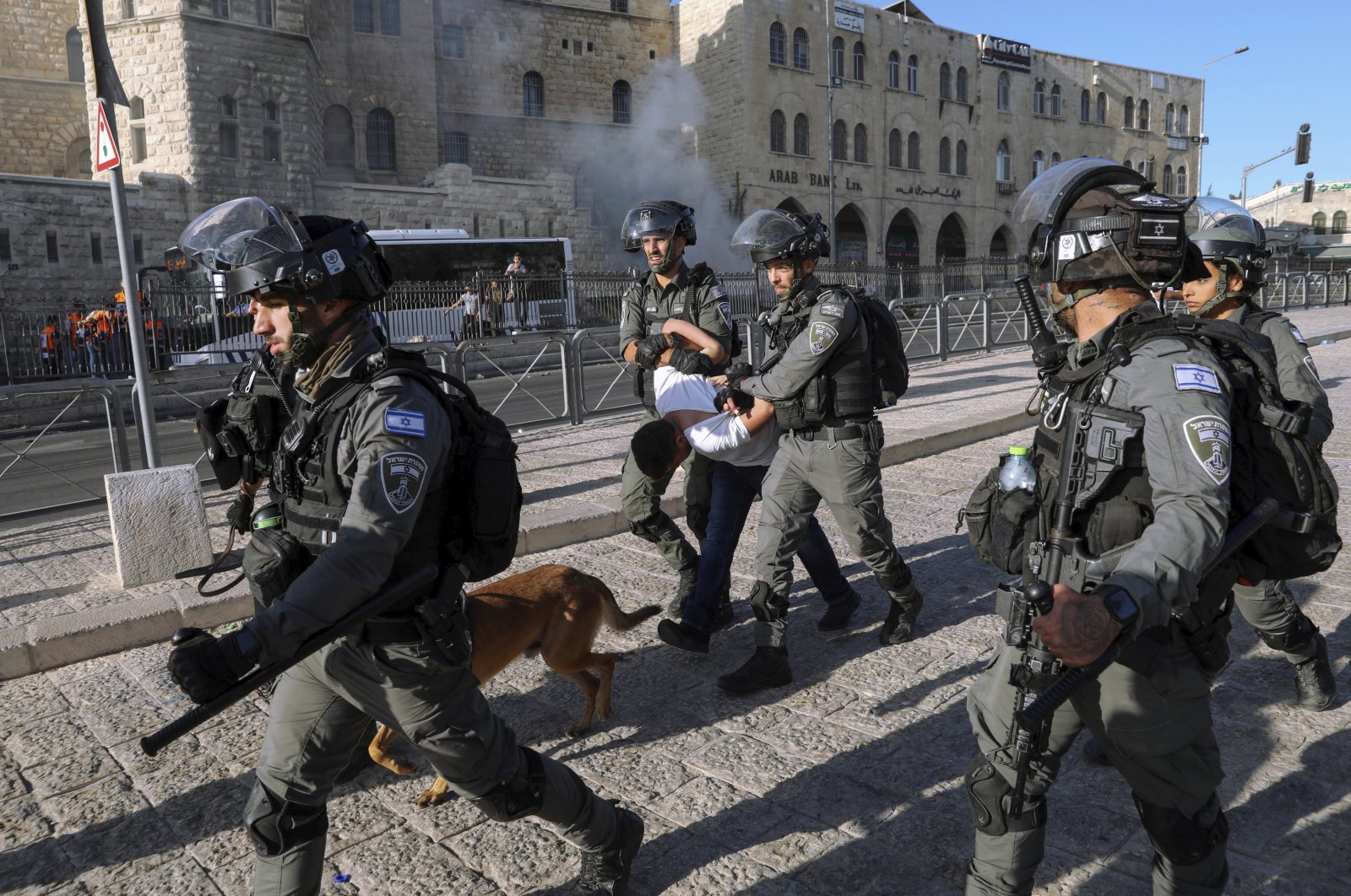 Israeli border police officers detain a Palestinian youth during clashes between Palestinians and Israeli police as thousands of Muslims flocked to Jerusalem's Old City to celebrate the Prophet Muhammad's birthday, East Jerusalem, occupied Palestine, Oct. 19, 2021. (AP Photo)