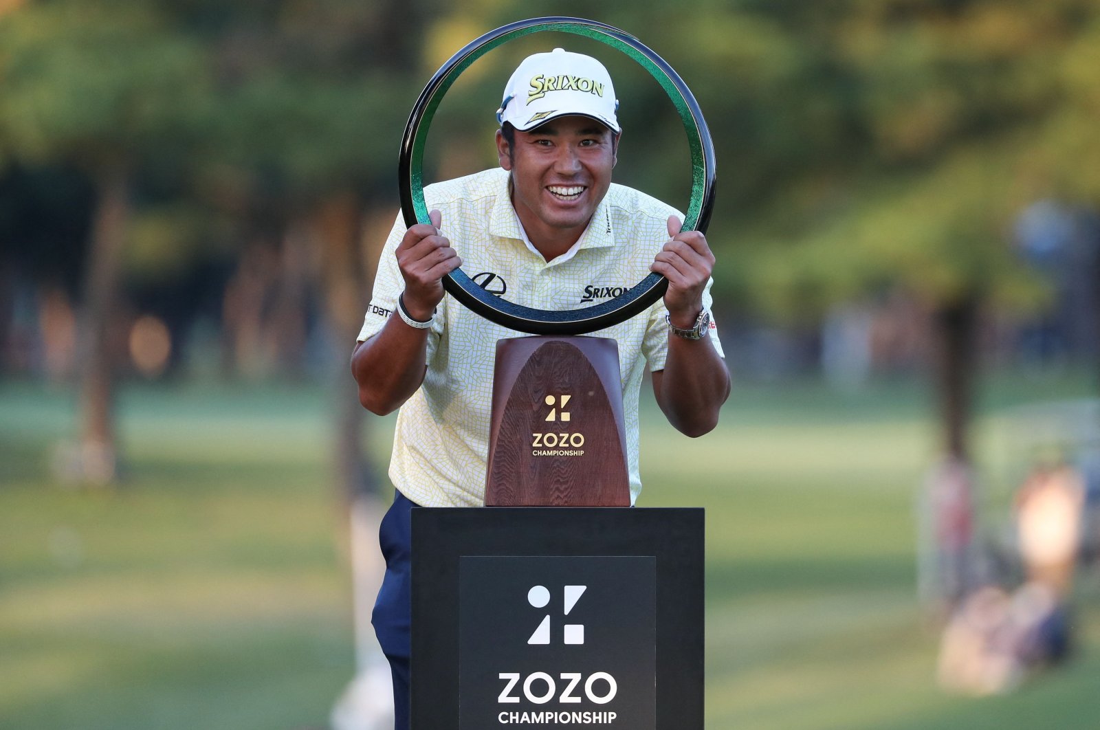 Japan's Hideki Matsuyama poses with the trophy after winning the PGA ZOZO Championship golf tournament at the Narashino Country Club in Inzai, Chiba prefecture, Japan, Oct. 24, 2021. (AFP Photo)