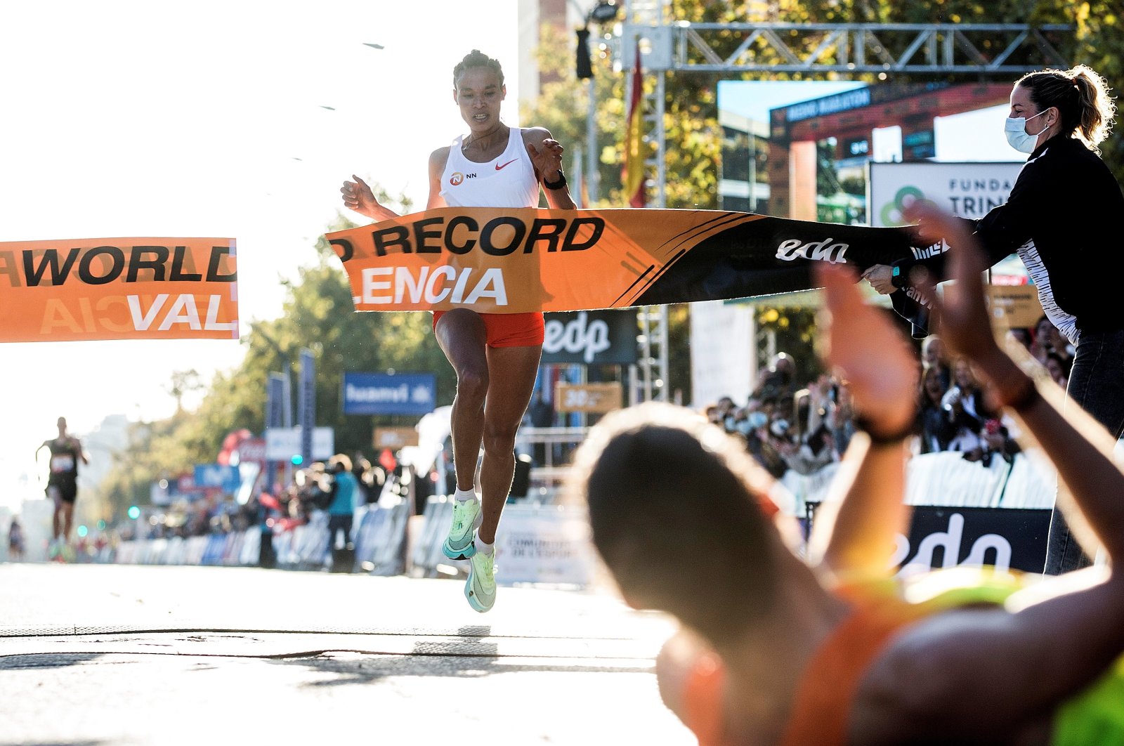Ethiopia's Letesenbet Gidey crosses the finish line and breaks the world record at the Valencia Half Marathon in the coastal city of Valencia, eastern Spain, Oct. 24, 2021. (EPA Photo)