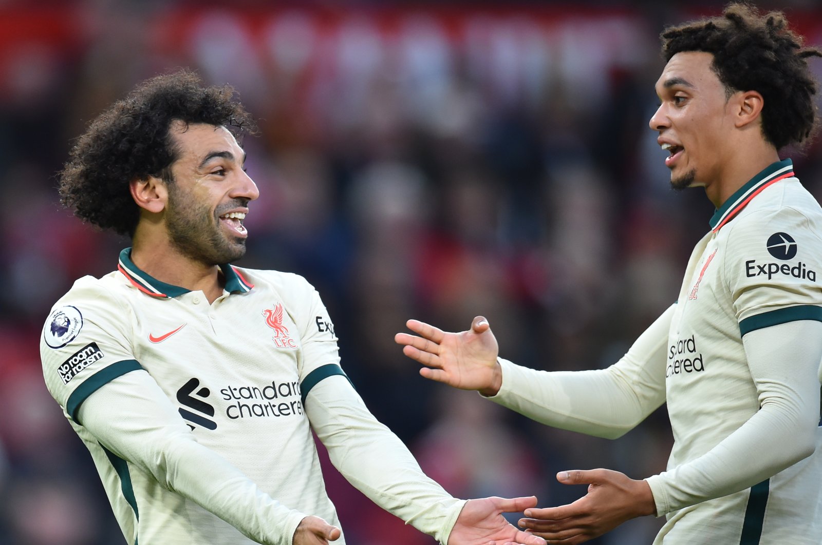 Liverpool's Mohamed Salah (L) celebrates with Trent Alexander-Arnold (R) after scoring the 0-3 goal during the English Premier League soccer match between Manchester United and Liverpool FC in Manchester, Britain, Oct. 24, 2021. (EPA Photo)