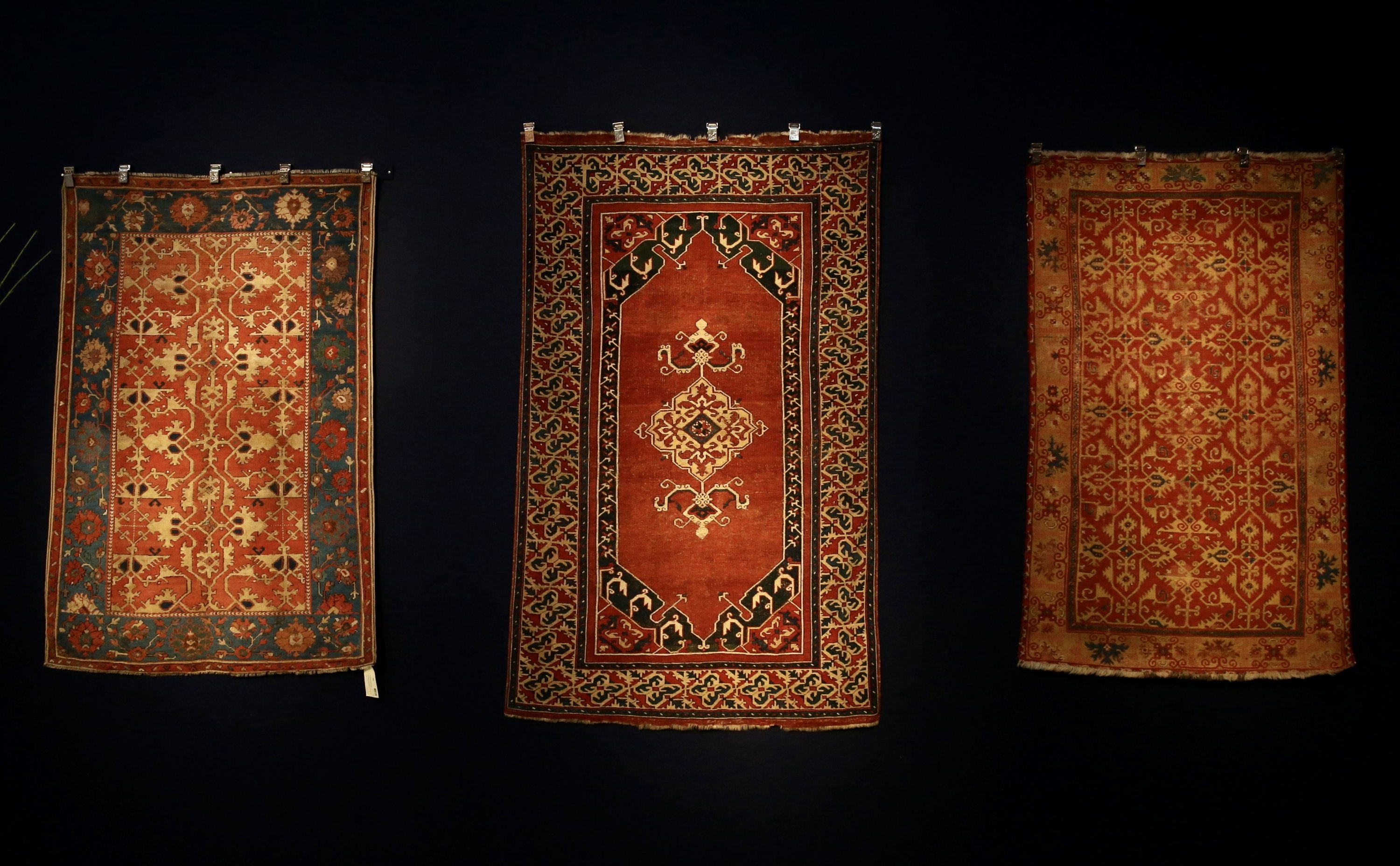 Three Turkish carpets with a Lotto design on display at Christie’s, London, Oct. 22, 2021. (AA Photo)