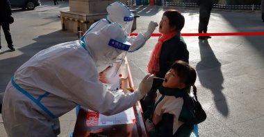 Residents undergo nucleic acid tests for COVID-19 in Zhangye, northwestern Gansu province, China, Oct. 23, 2021. (AFP Photo)