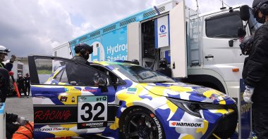 A hydrogen engine car being refueled during the five-hour-long Super Taikyu Race at Autopolis in Hita, Oita prefecture, southern Japan, July 31, 2021. (Photo by Toyota Motor Corp. via AP)