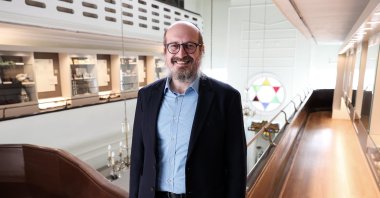 Mendy Chitrik poses inside an ancient synagogue converted into a cultural center, in Istanbul, Turkey, Oct. 22, 2021. (AA PHOTO)