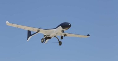 This handout photo made available by the Iranian Army press office on Oct. 21, 2021 shows a military drone flying above an undisclosed location in Iran during a military exercise. (Photo by Iranian Army office / AFP)