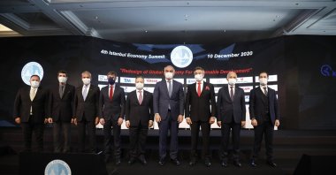 Culture and Tourism Minister Mehmet Nuri Ersoy (C) and other officials and executives pose for a photo on the sidelines of the fourth Istanbul Economic Summit, in Istanbul, Turkey, Dec. 10, 2020. (Courtesy of Istanbul Economic Summit)