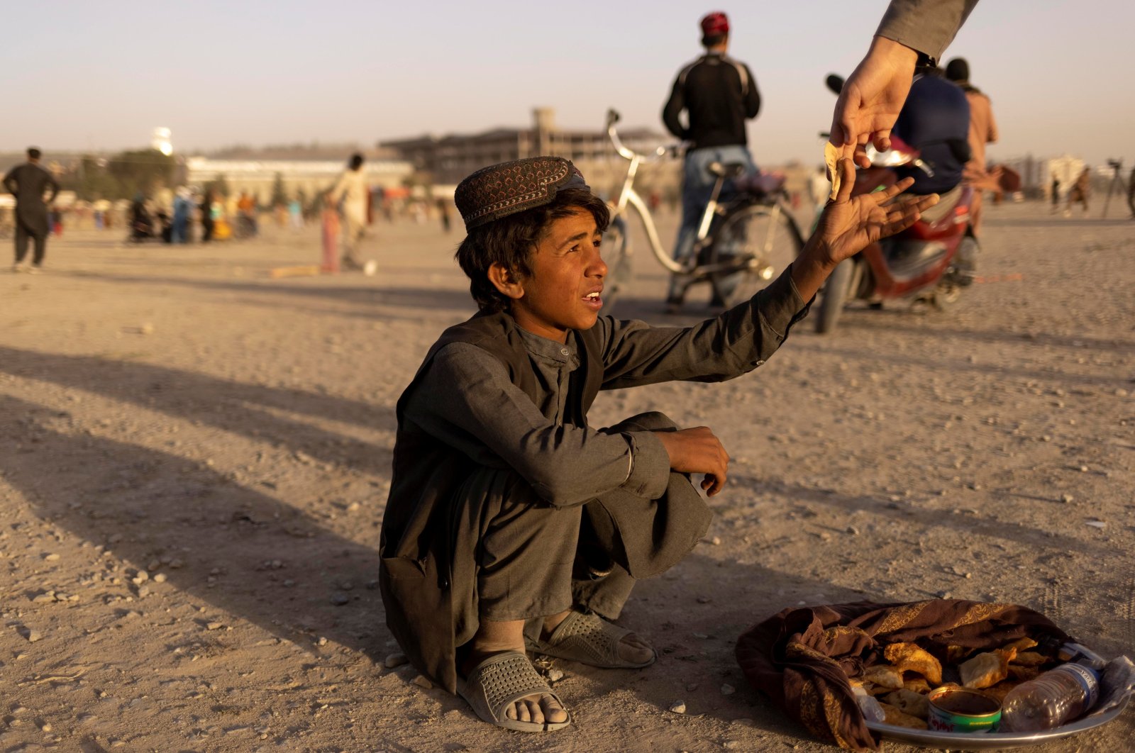 A boy sells food in a park in Kabul, Afghanistan, Oct. 22, 2021. (Reuters Photo)