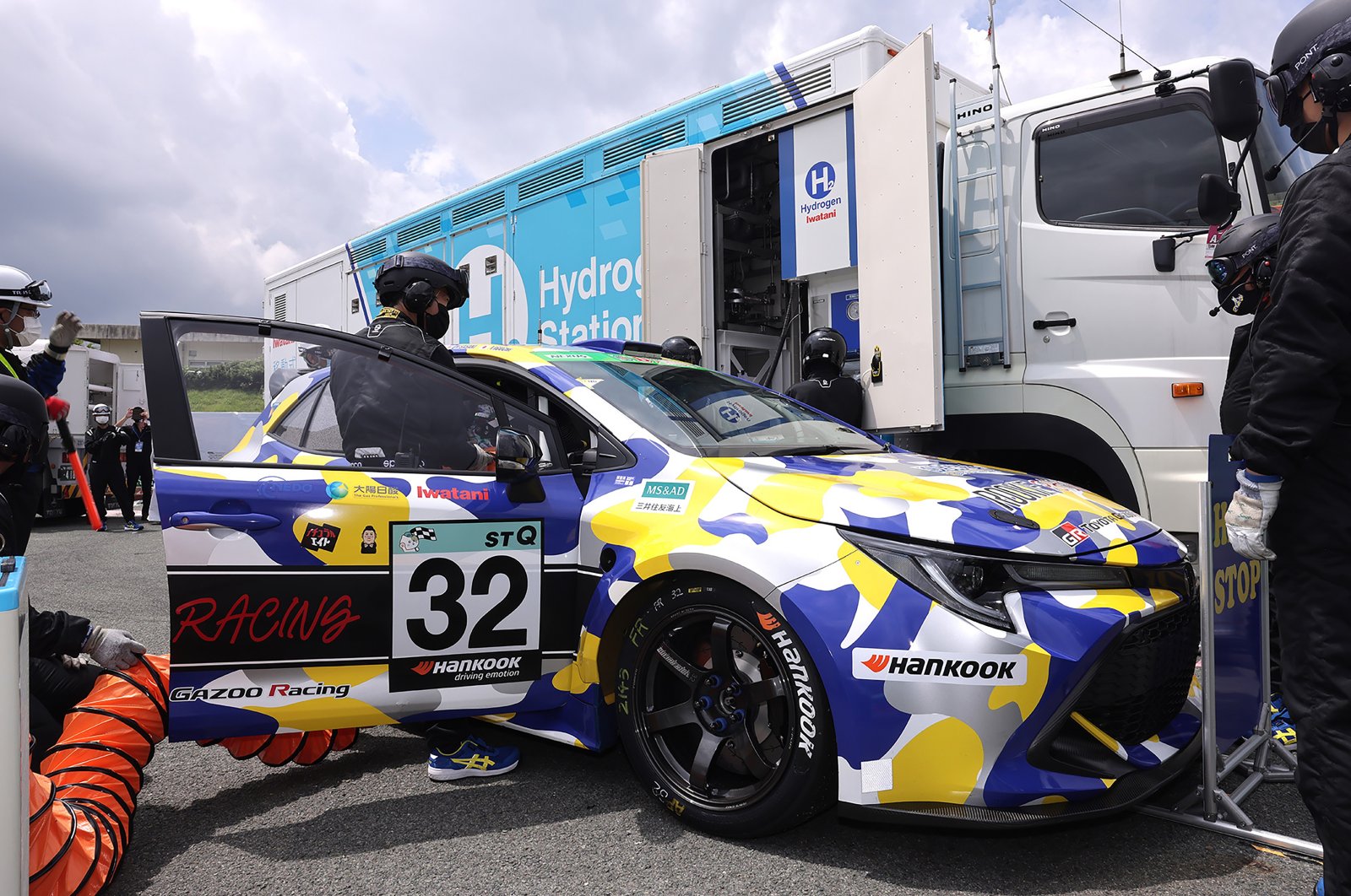A hydrogen engine car being refueled during the five-hour-long Super Taikyu Race at Autopolis in Hita, Oita prefecture, southern Japan, July 31, 2021. (Photo by Toyota Motor Corp. via AP)