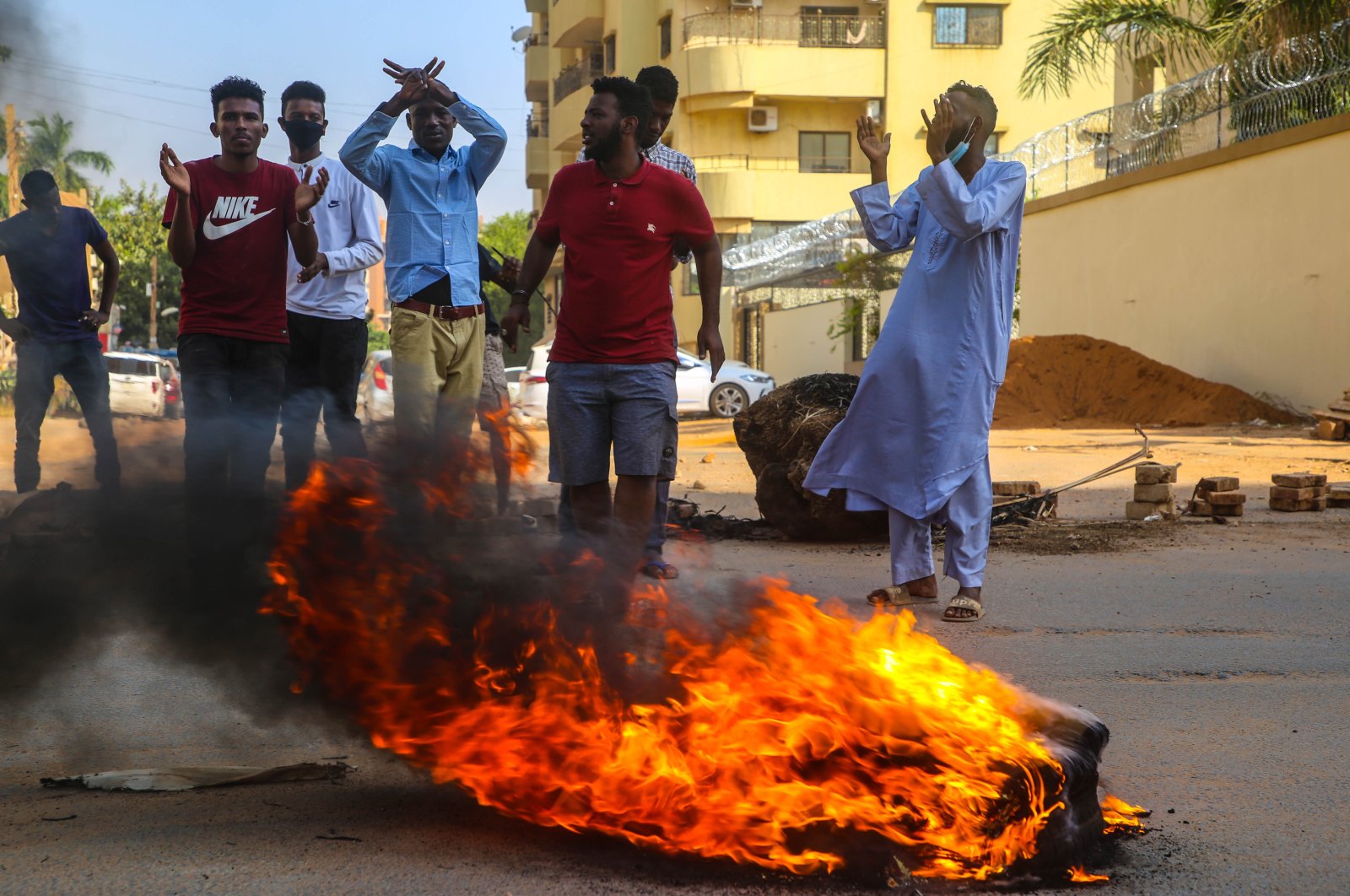 Sudanese protesters chant near burning tires during a demonstration in the capital Khartoum, Sudan, Oct. 25, 2021. (EPA Photo)