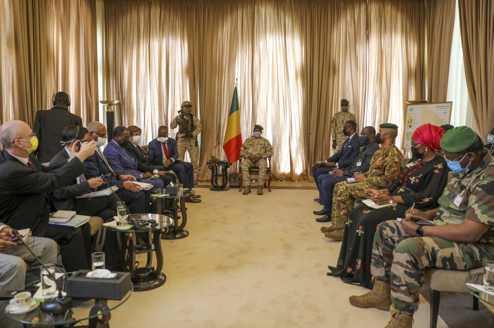 Malian Transition President Col. Assimi Goita, center, holds a meeting with a United Nations Security Council mission led by Kenya's Ambassador to the U.N. Martin Kimani in Bamako, Mali, Oct. 24, 2021. (AP Photo)