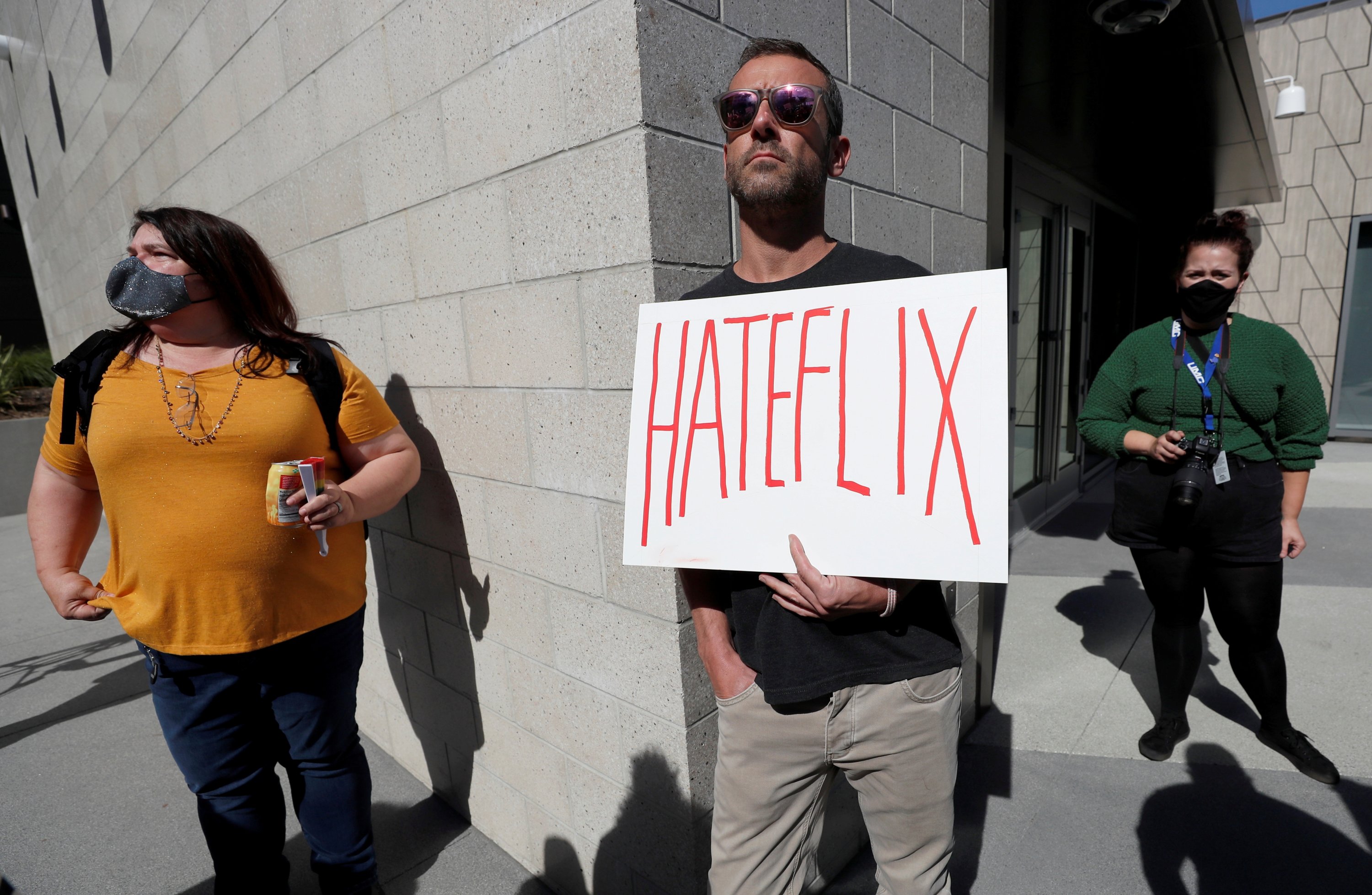 A man holds a placard as he attends a Netflix transgender employee walkout to protest the streaming of comedian Dave Chappelle's new comedy special, in Los Angeles, California, U.S., Oct. 20 2021. (Reuters Photo)