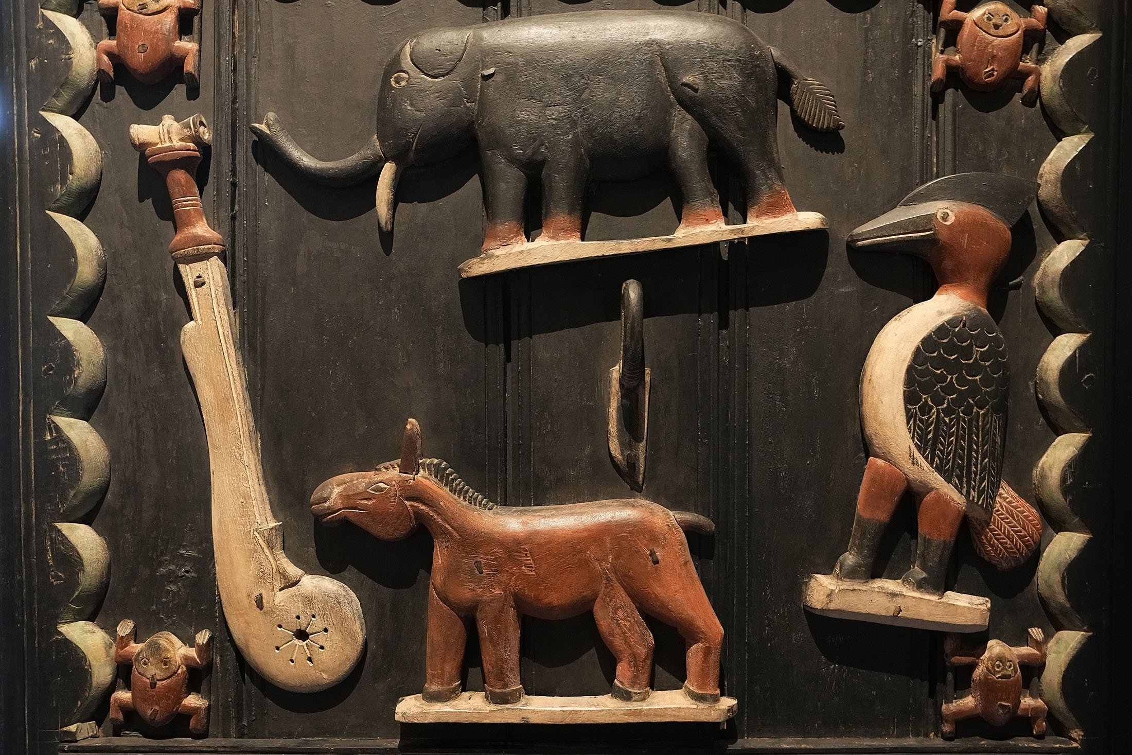 A detail in the door of King Glele palace, from Benin 19th century, pictured at the Quai Branly – Jacques Chirac museum, in Paris, France, Oct. 25, 2021. (AP Photo)