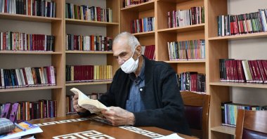 Hacı Ahmet Gönen reads a book at the library, in Kahramanmaraş, southern Turkey, Sept. 25, 2021. (AA Photo)