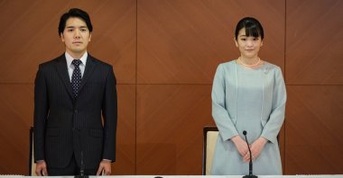 Princess Mako (R), the elder daughter of Prince Akishino and Princess Kiko, and her husband Kei Komuro (L), a university friend of Princess Mako, poses during a press conference to announce their marriage registration at Grand Arc Hotel in Tokyo, Japan, Oct. 26, 2021. (EPA Photo) 