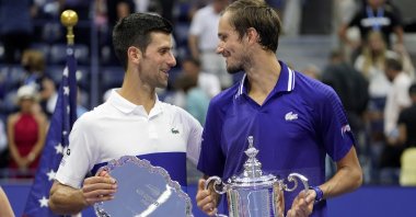 Serbia's Novak Djokovic (L) and Russia's Daniil Medvedev talk during the trophy ceremony after the U.S. Open men's singles final in New York, U.S., Sept. 12, 2021. (AP Photo)