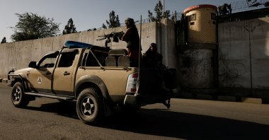 Taliban fighters ride on the back of a pickup truck as they patrol along a road in Kabul, Afghanistan, Oct. 23, 2021. (Reuters Photo)