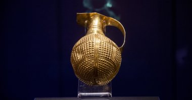 A photo showing the golden beak-spouted ewer on display in the Museum of Anatolian Civilization. (Photo by Anadolu Agency)