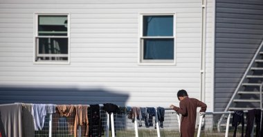 An Afghan refugee stands outside temporary housing at Ft. McCoy U.S. Army base, Sept. 30, 2021, Wisconsin, U.S. (AFP Photo)