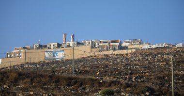 An Israeli flag is painted on the surrounding wall of the West Bank Jewish settlement of Migdalim near the Palestinian town of Nablus, Monday, Oct. 25, 2021. (AP Photo)