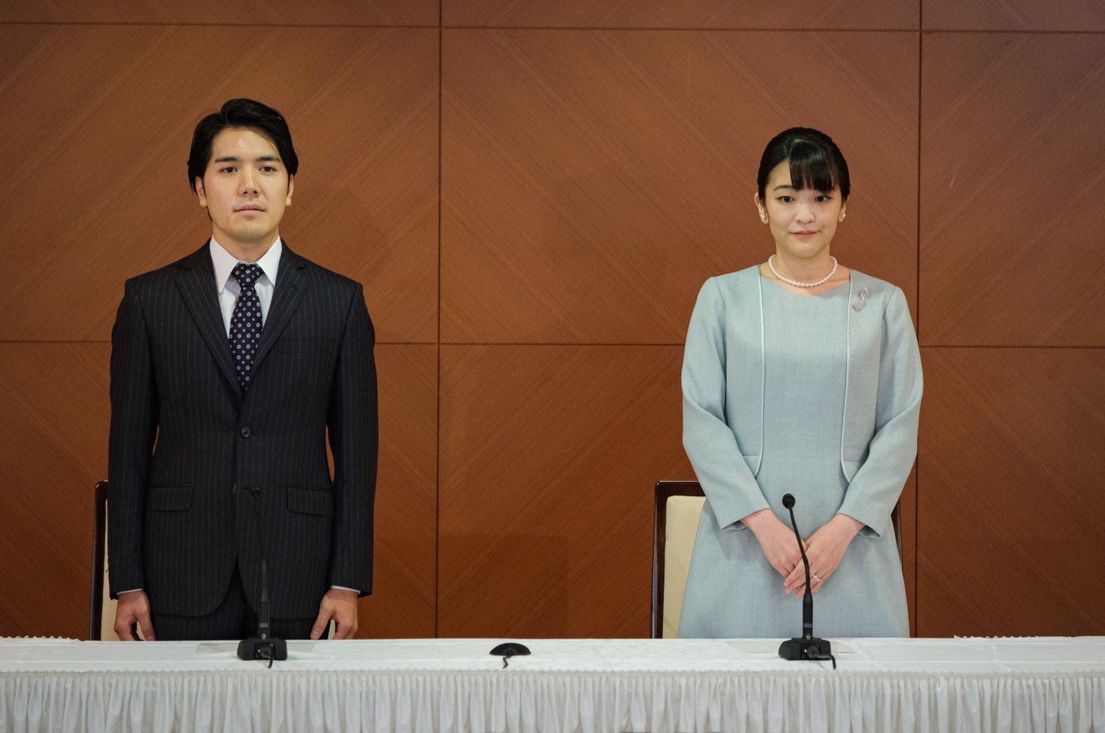 Princess Mako (R), the elder daughter of Prince Akishino and Princess Kiko, and her husband Kei Komuro (L), a university friend of Princess Mako, poses during a press conference to announce their marriage registration at Grand Arc Hotel in Tokyo, Japan, Oct. 26, 2021. (EPA Photo) 