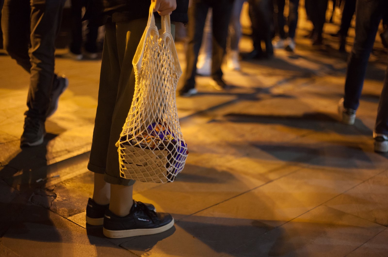 A person holds a net bag, in Istanbul, Turkey, Feb. 11, 2019. (Shutterstock Photo)