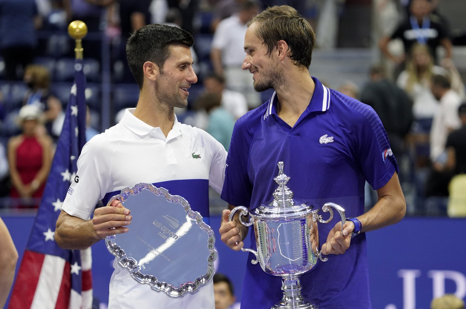 Serbia's Novak Djokovic (L) and Russia's Daniil Medvedev talk during the trophy ceremony after the U.S. Open men's singles final in New York, U.S., Sept. 12, 2021. (AP Photo)