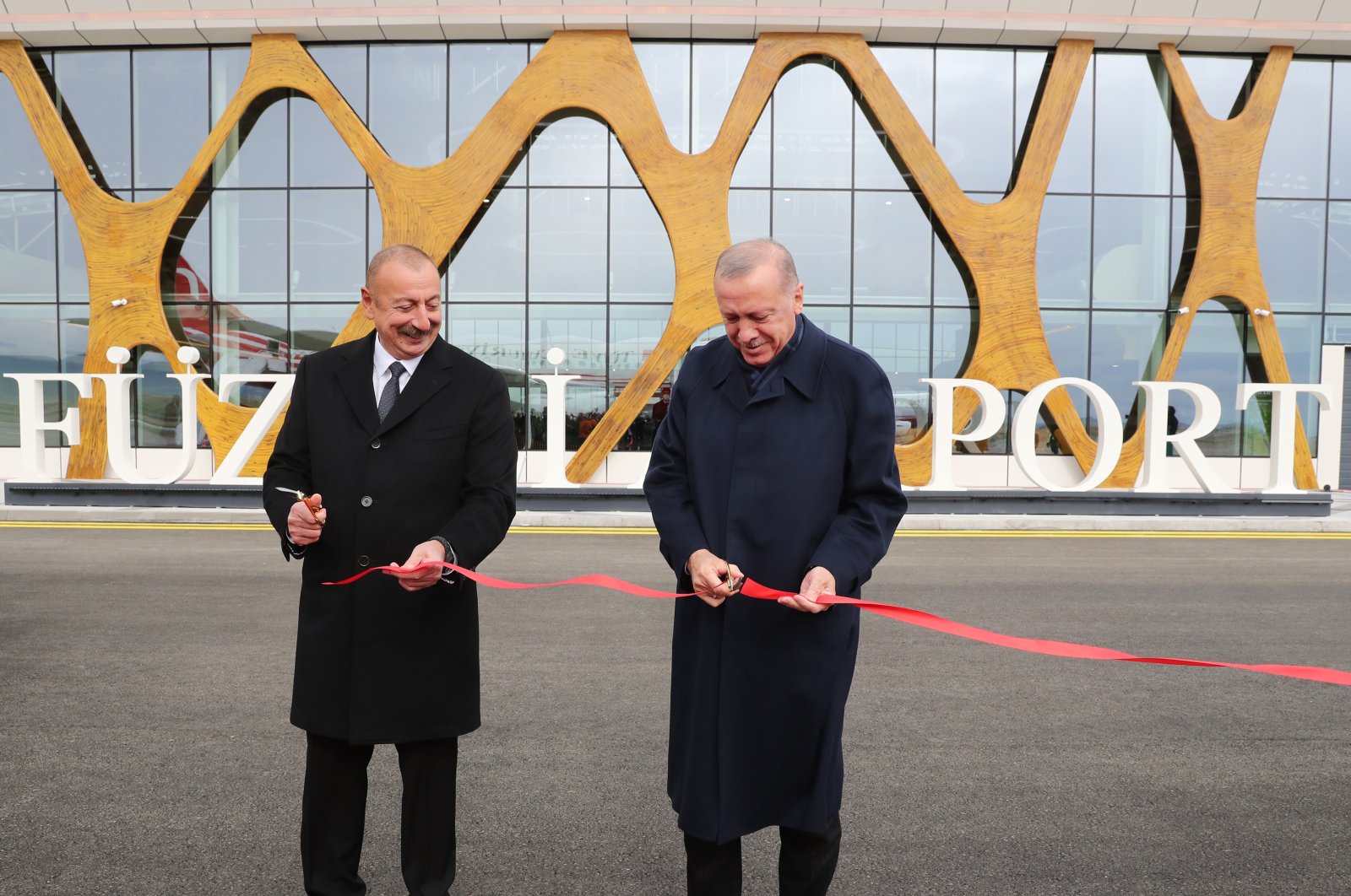 President Recep Tayyip Erdoğan (R) and his Azerbaijani counterpart Ilham Aliyev inaugurate the Fuzuli International Airport, Fuzuli, Azerbaijan, Oct. 26, 2021. (AA Photo)

