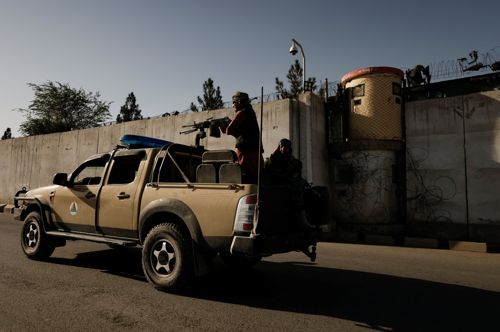 Taliban fighters ride on the back of a pickup truck as they patrol along a road in Kabul, Afghanistan, Oct. 23, 2021. (Reuters Photo)