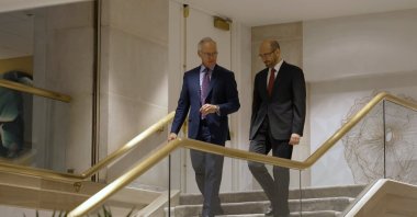 In this summer 2021 photo provided by CBS News, former senior Saudi security official Saad al-Jabri (R) walks with journalist Scott Pelley in Washington during an interview for "60 Minutes." (CBS News/60 Minutes via AP)