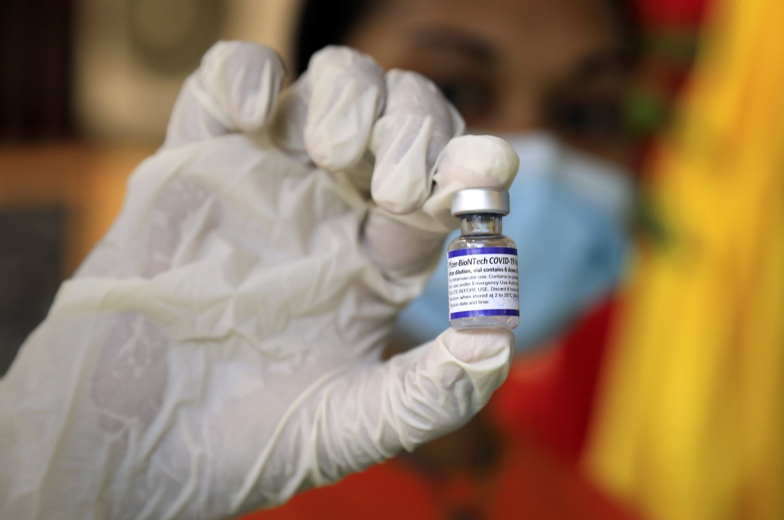 A healthcare worker shows a vial of Pfizer COVID-19 vaccine during a vaccination drive for children over twelve years of age in Dili, East Timor, also known as Timor Leste, 27 Oct. 2021. (EPA Photo) 