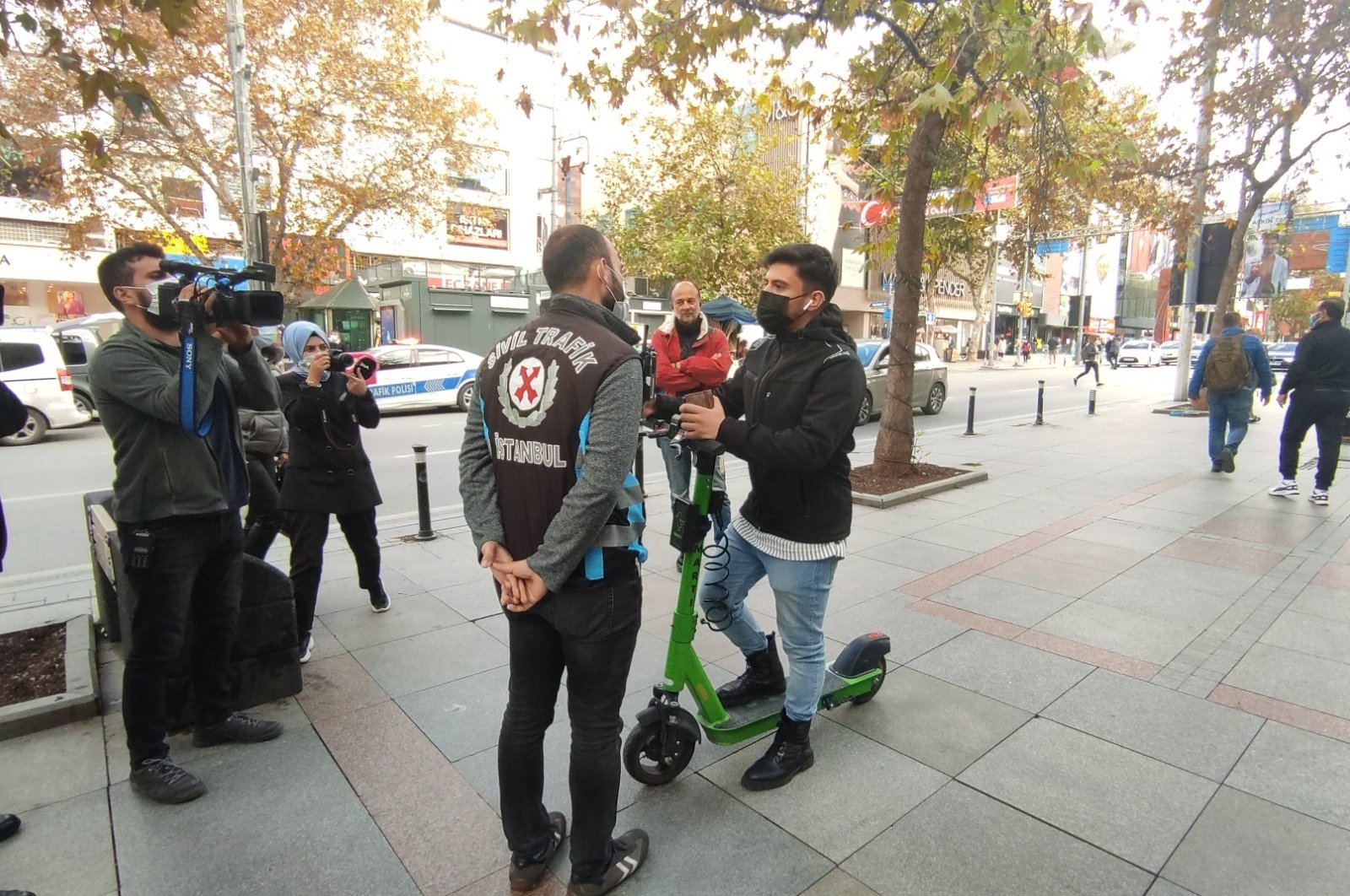 A police officer speaks with a scooter rider during inspections, in Istanbul, Turkey, Oct. 27, 2021. (AA Photo)