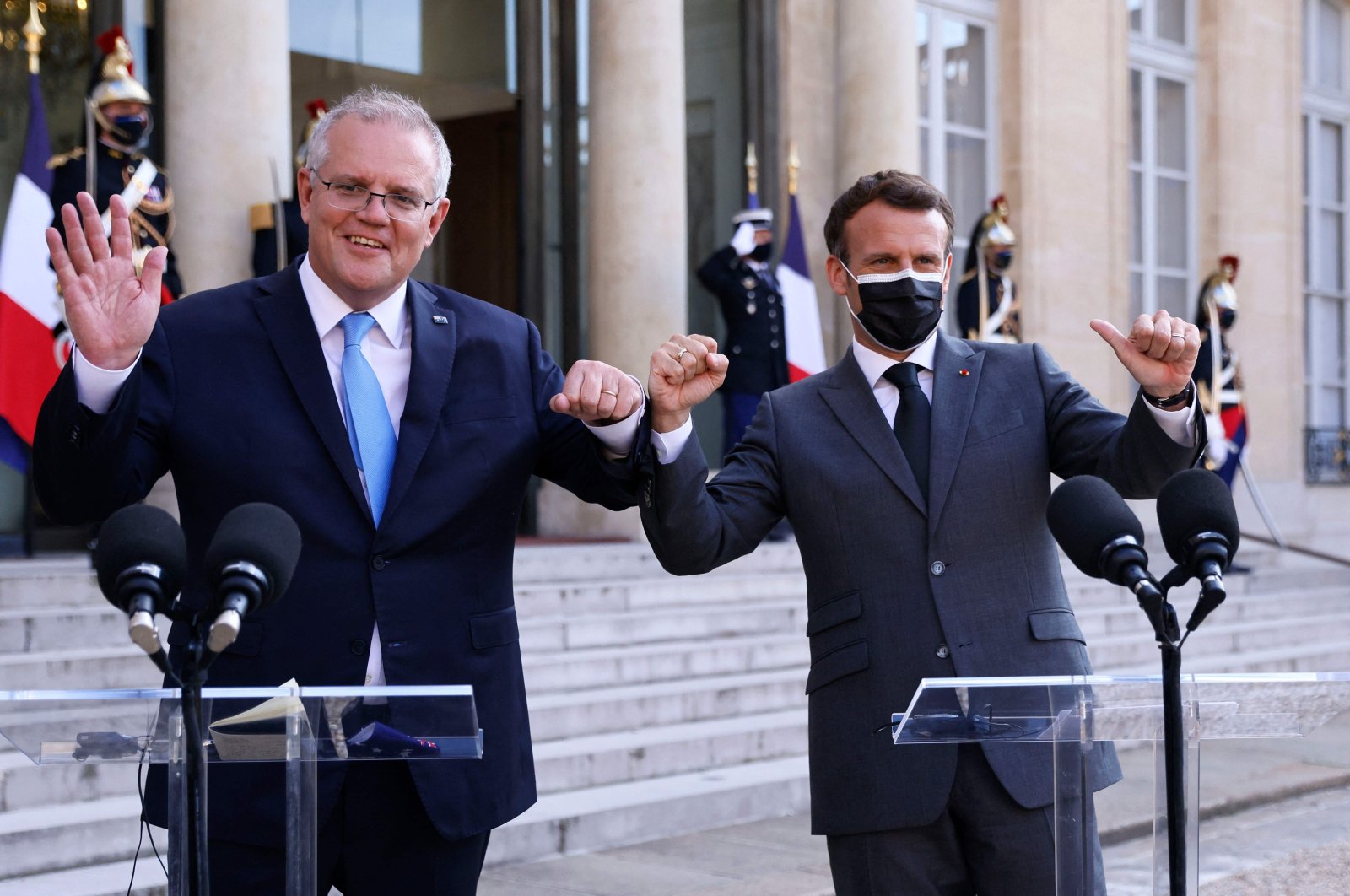 French President Emmanuel Macron (R) and Australia's Prime Minister Scott Morrison answer the press prior to a working diner at the Elysee Palace in Paris, June 15, 2021. (AFP Photo)
