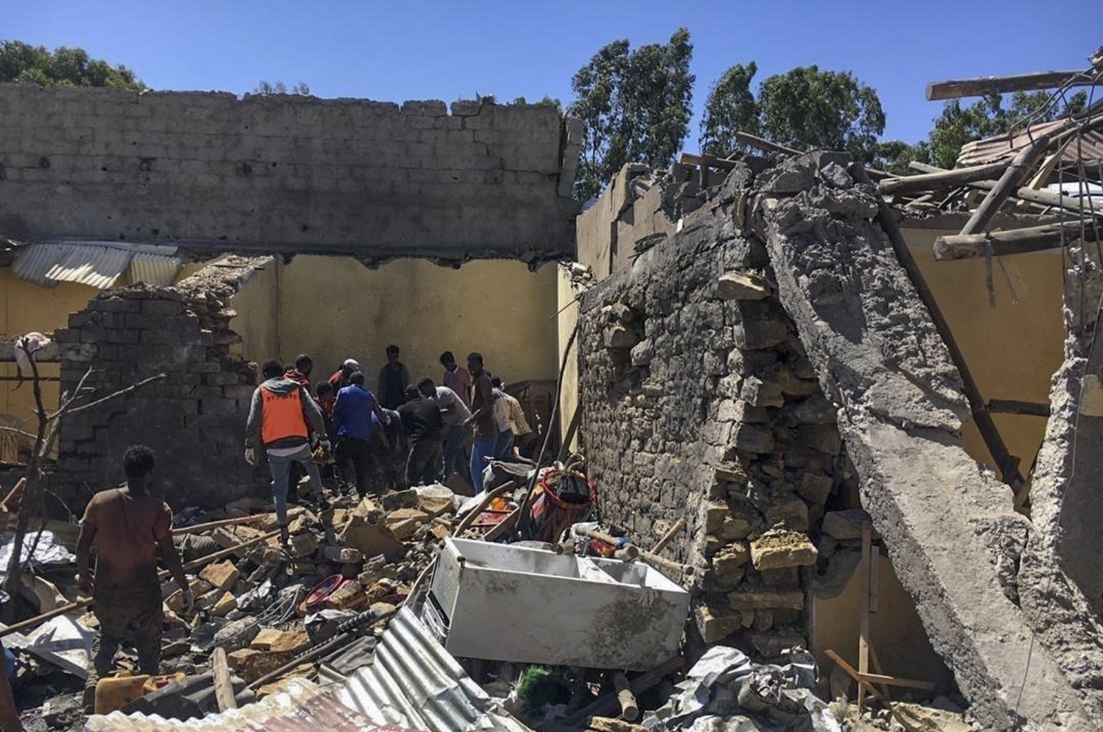 Residents sift through rubble from a destroyed building at the scene of an airstrike in Mekele, in the Tigray region of northern Ethiopia, Oct. 28, 2021. (AP Photo)