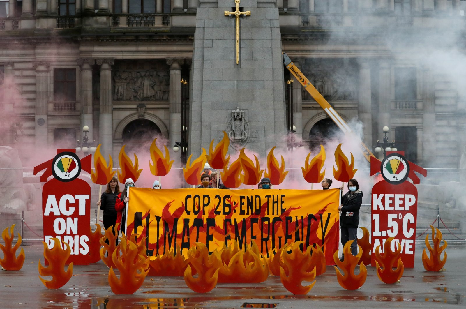Activists symbolically set George Square on fire with an art installation of faux flames and smoke ahead of the U.N. climate change conference (COP26), in Glasgow, Scotland, Oct. 28, 2021. (Reuters Photo)
