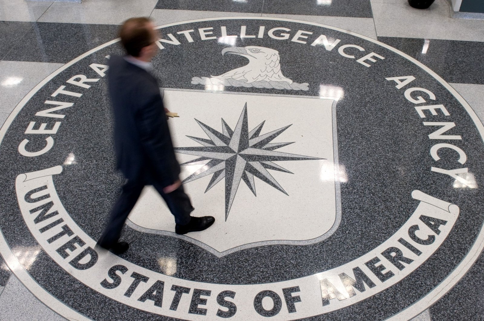 A man walks over the seal of the Central Intelligence Agency (CIA) in the lobby of its headquarters in Langley, Virginia, U.S., Aug. 13, 2008. (AFP File Photo)