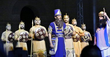 Artists perform during the opening ceremony of Babylon International Festival, at the archaeological site of ancient Babylon, about 100 kilometers (62 miles) south of the Iraqi capital Baghdad on Oct. 28, 2021. (AFP)