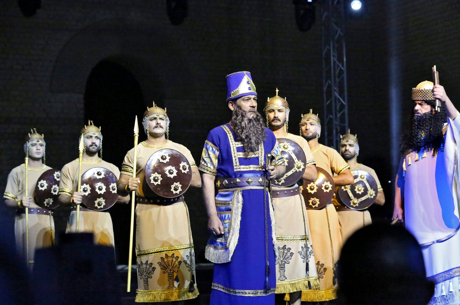 Artists perform during the opening ceremony of Babylon International Festival, at the archaeological site of ancient Babylon, about 100 kilometers (62 miles) south of the Iraqi capital Baghdad on Oct. 28, 2021. (AFP)