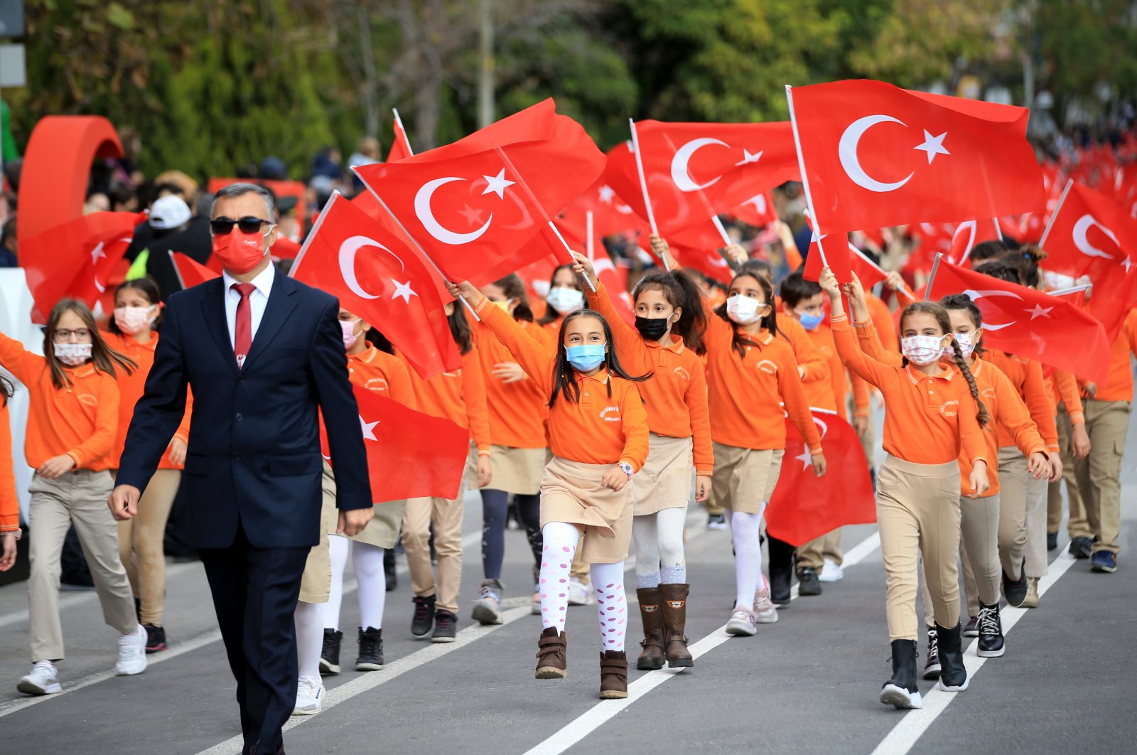 Students holding Turkish flags attend a Republic Day parade, in Kırklareli, northwestern Turkey, Oct. 29, 2021. (AA PHOTO) 