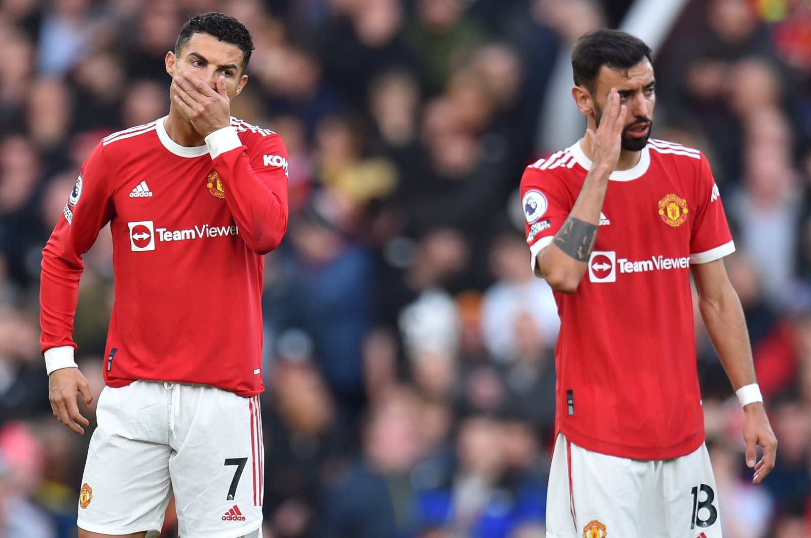 Manchester United's Cristiano Ronaldo (L) and Bruno Fernandes (R) react during a Premier League match against Liverpool in Manchester, England, Oct. 24, 2021. (EPA Photo)