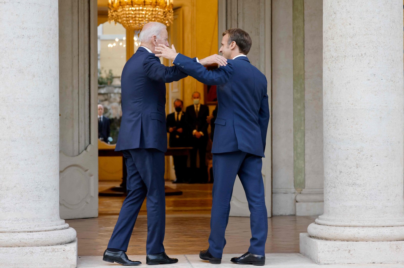 French President Emmanuel Macron (R) welcomes US President Joe Biden (L) before their meeting at the French Embassy to the Vatican in Rome, Oct. 29, 2021. (AFP Photo)