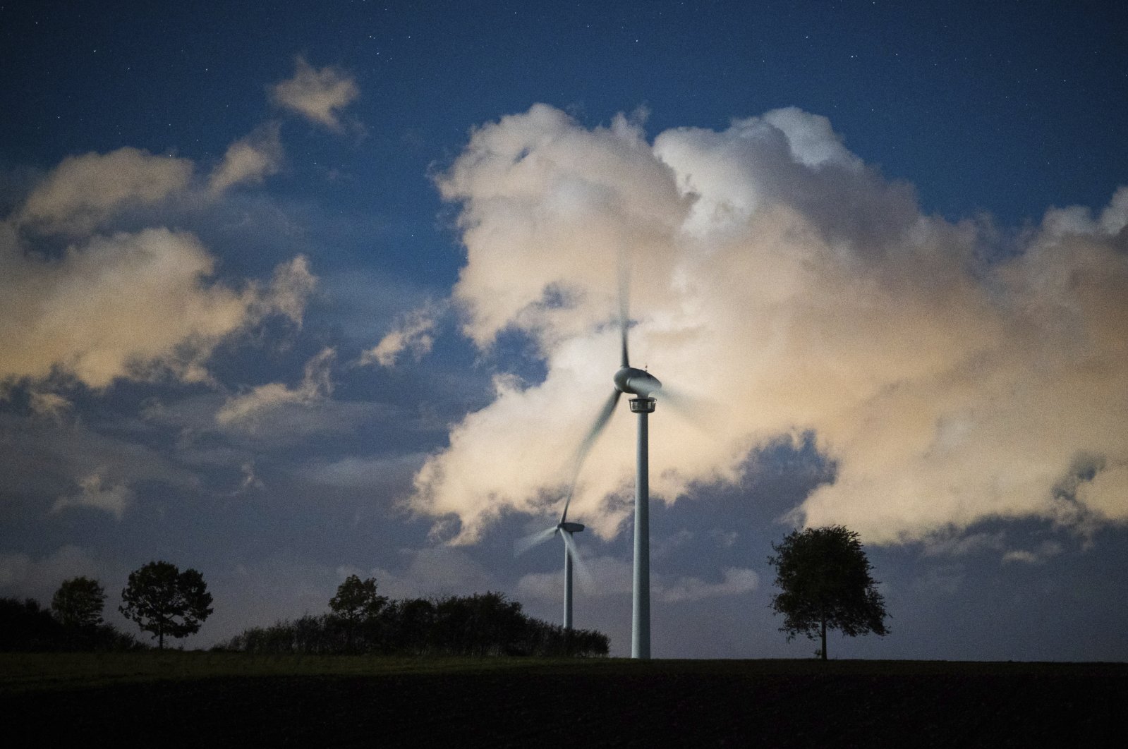 Clouds over wind turbines at early morning near Hanover, Germany, Oct. 23, 2021. (AP Photo)