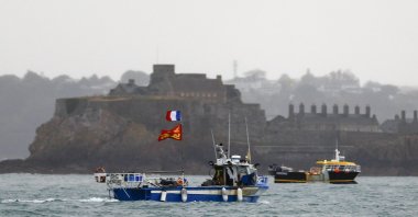 French fishing boats protest in front of the port of Saint Helier off the British island of Jersey to draw attention to what they see as unfair restrictions on their ability to fish in UK waters after Brexit, Jersey, United Kingdom, May 6, 2021. (AFP Photo)