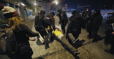 Police officers detain a supporter of Russian opposition leader Alexei Navalny, who was poisoned with a nerve agent from the Novichok group, at the Vnukovo International Airport in Moscow, Russia, January 17, 2021.