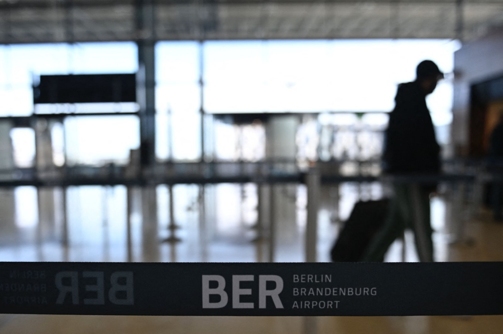 A passenger is pictured at Terminal 1 of Berlin Brandenburg "Willy Brandt" airport in Brandenburg, near Schonefeld and Berlin, Germany, Feb. 20, 2021. (AFP File Photo)